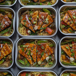 Asian marinated beef on noodles and vegetable sauté