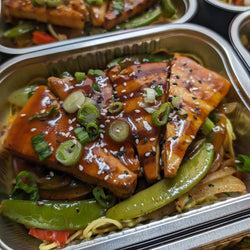 Asian marinated beef on noodles and vegetable sauté