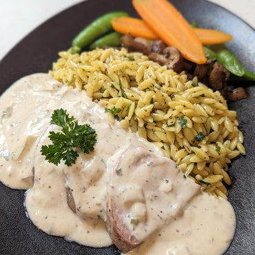 Pork tenderloin in creamy herb sauce